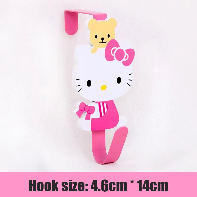 A pink and white cartoon cat hook with a yellow kitten charm, designed for over-the-door hanging storage.