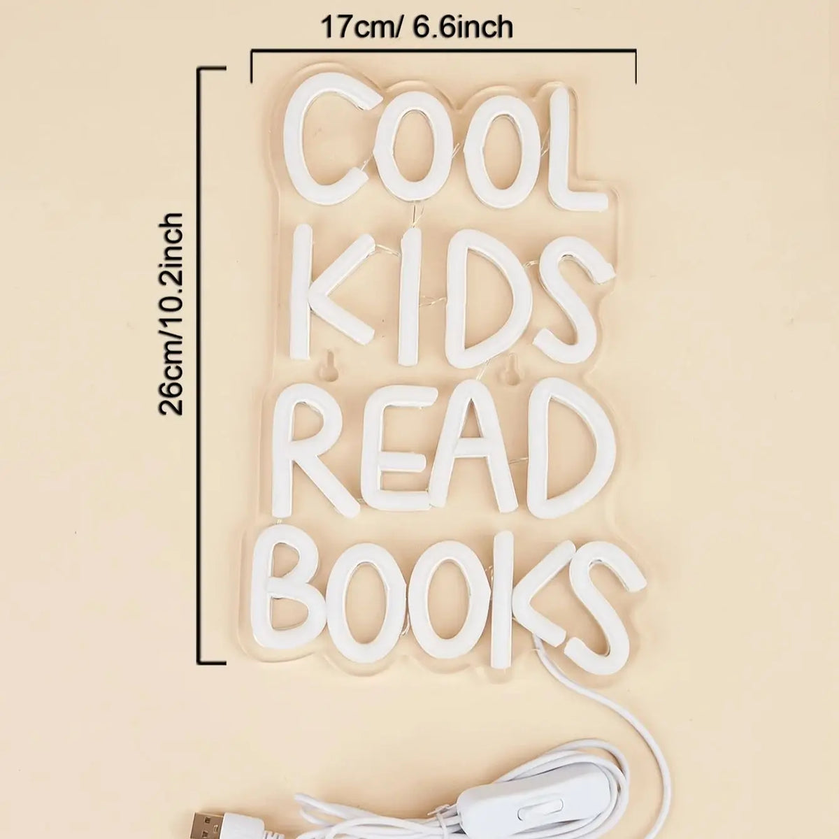 A white neon sign shaped like the words COOL KIDS READ BOOKS, measuring 17cm long.