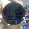 A hand holds a round, black obsidian mirror for psychic protection and divination.