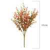 A sprig of UV-resistant artificial daisy bouquet with orange and green leaves on a thin stem.