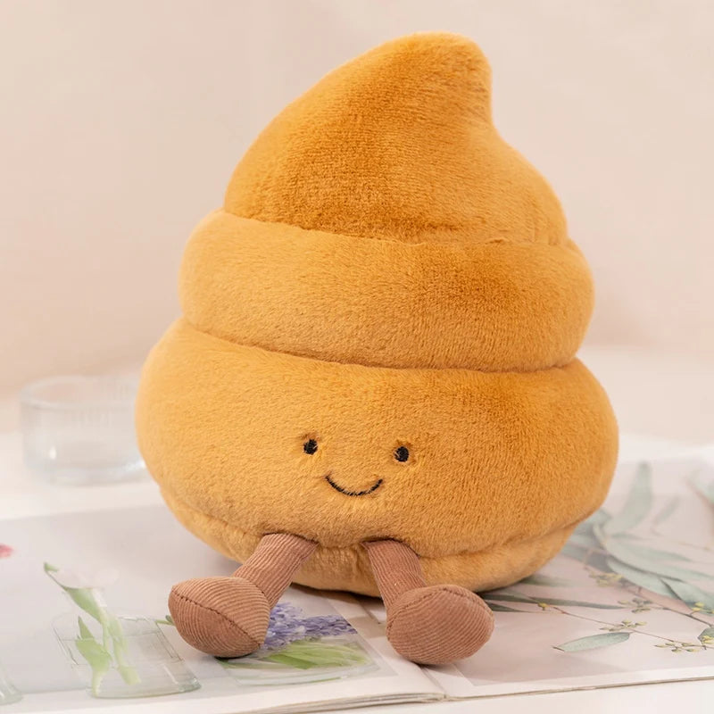 A fluffy orange plush toy shaped like a toilet paper poop plunger with small arms and a smiling face.