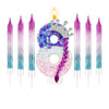 A set of gradient sparkle number birthday candles, including the number eight, in purple and blue shades.