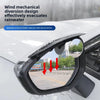 Carbon fiber rearview mirror rain guard with integrated blind spot mirror installed on a white car.