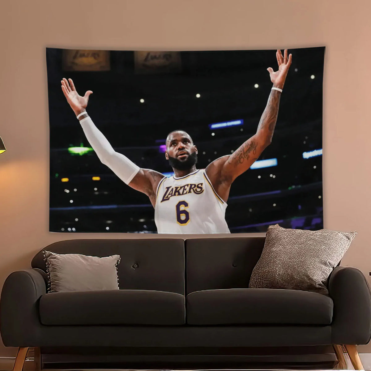 A wall tapestry featuring a basketball player celebrating with his arms raised against a dark, stadium background.