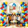 A colorful arch garland made of balloons featuring a cartoon clown theme for a party decoration.