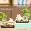 Mini resin desk ornament featuring a green ivy plant and a white lucky cat in a clear glass vase