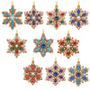 A set of ornate diamond art pendants featuring Christmas themes like Santa, snowman, and reindeer in gold and colored stones.