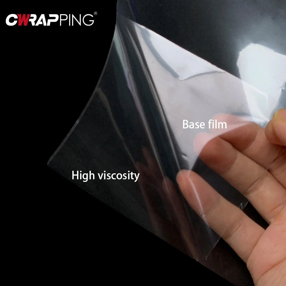 Hand touching a sheet of base film demonstrating high viscosity for transparent PVC furniture protector film.
