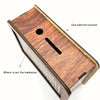 A wooden savings box with a coin insertion location and a slot for banknotes, showing progress tracking lines.