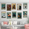 A gallery wall featuring nine framed pieces of rustic metal no trespassing style wall art with various animal subjects and na