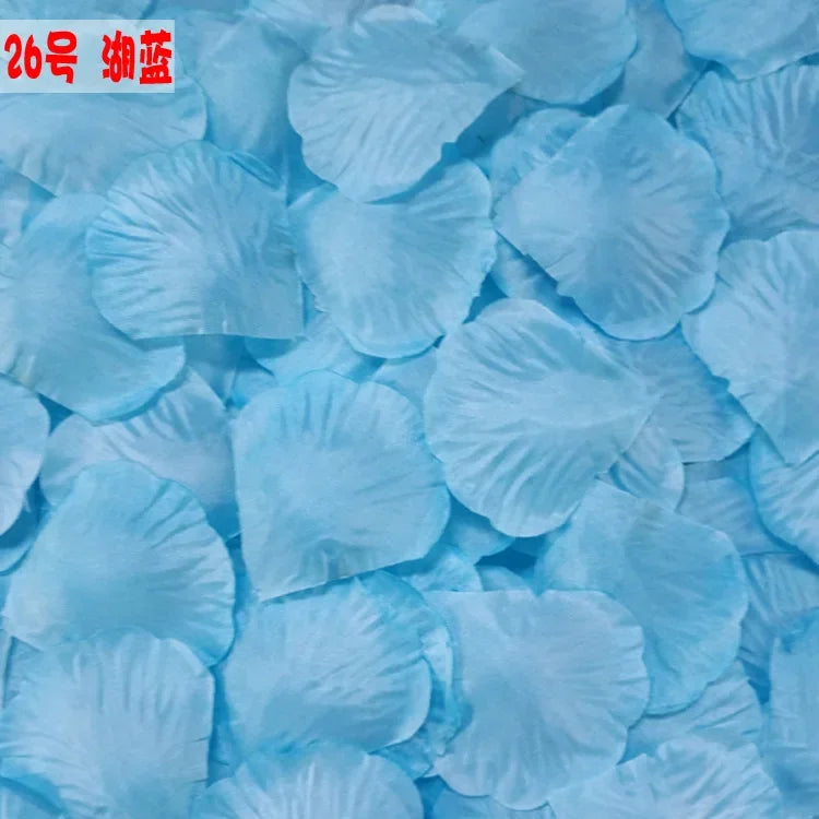 A pile of light blue silk rose petals used for weddings and events.