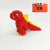 A red collectible 3D printed Godzilla sitting figure next to an orange tag labeled in Chinese characters.