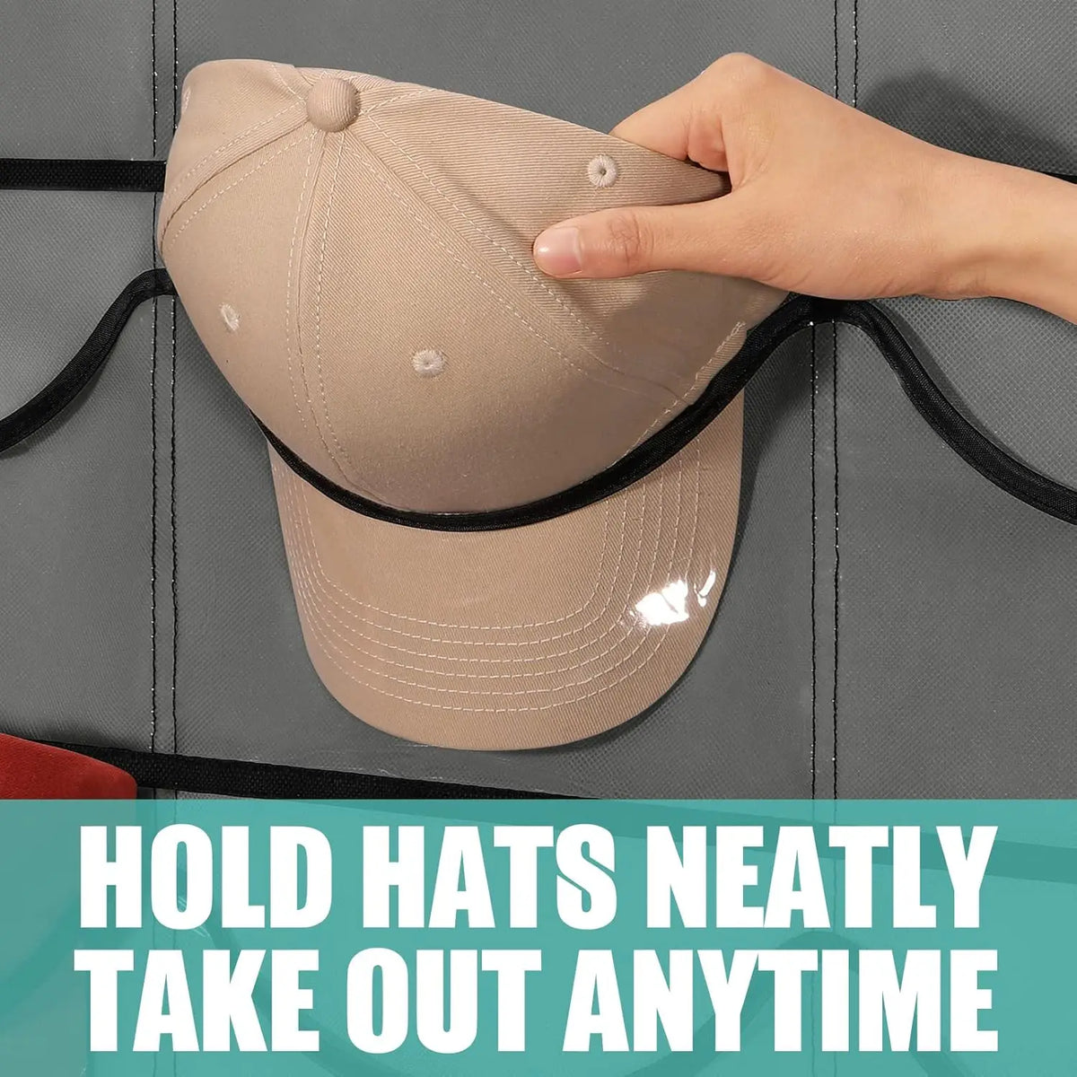 A hand is holding a beige clear door hat organizer with a black strap, demonstrating how to neatly take out hats.