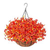 Realistic artificial orange and yellow flowers in a hanging basket suspended by chains