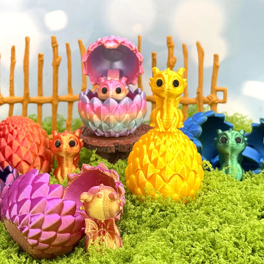 A collection of colorful 3D printed dragon eggs and mini dragon toys displayed on green moss.