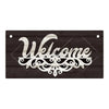 A rustic wooden hanging sign with the word Welcome carved in white relief on a dark wood background.