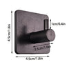 A black extra thick self-adhesive wall hook designed for hanging keys and jewelry.