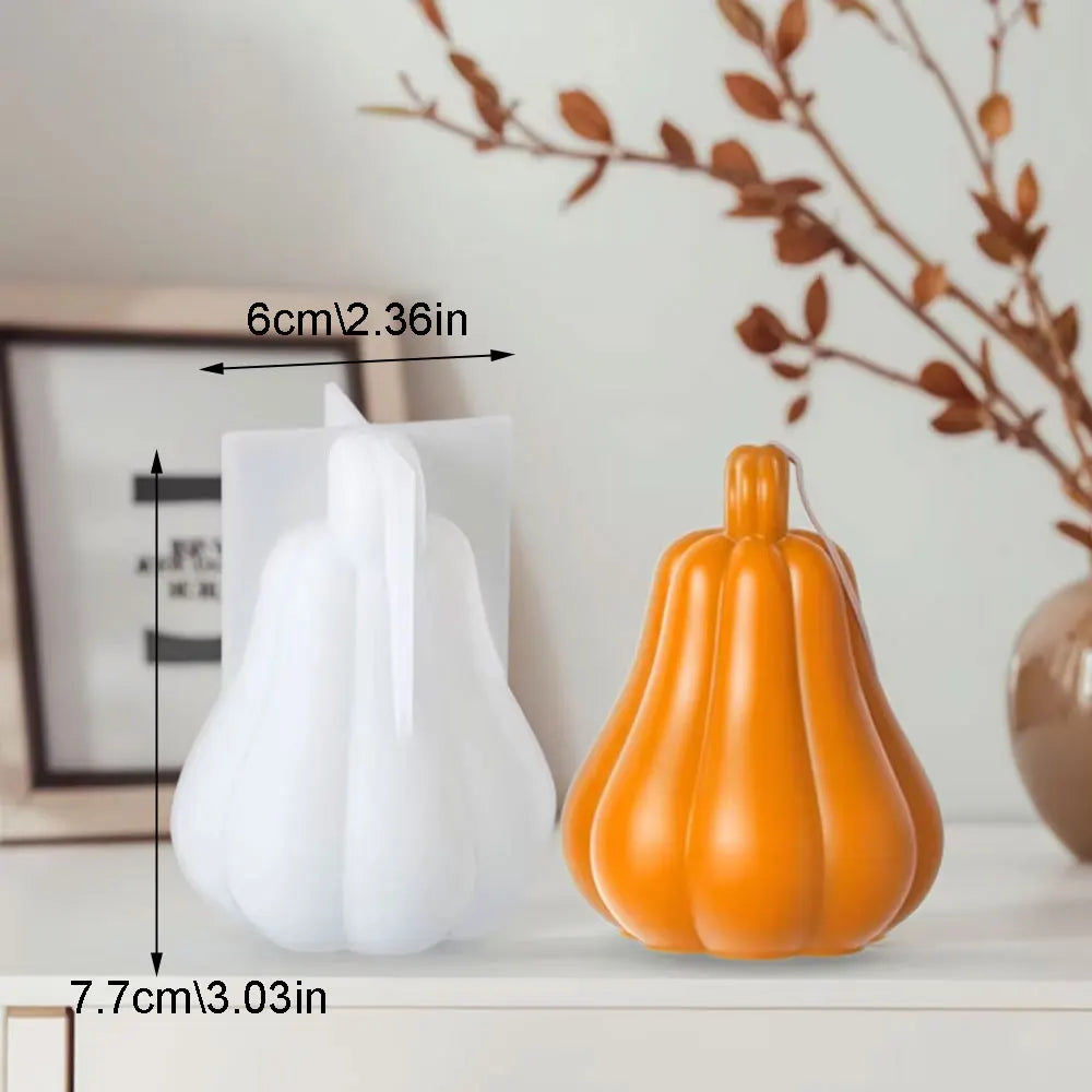 White and orange silicone pumpkin molds displayed on a white surface with dimension markings.