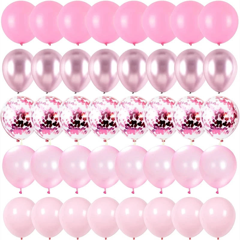 A collection of pink and iridescent latex balloons filled with confetti for party decorations
