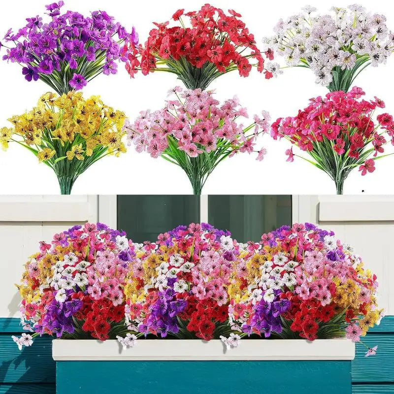 A vibrant bouquet of artificial violet flowers featuring purple, yellow, pink, and red blooms displayed on a wooden ledge.