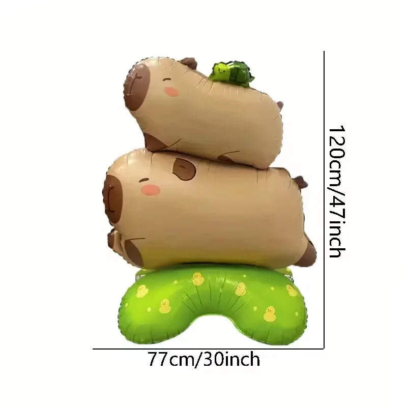 A standing foil balloon decoration shaped like a capybara with a turtle on its back.