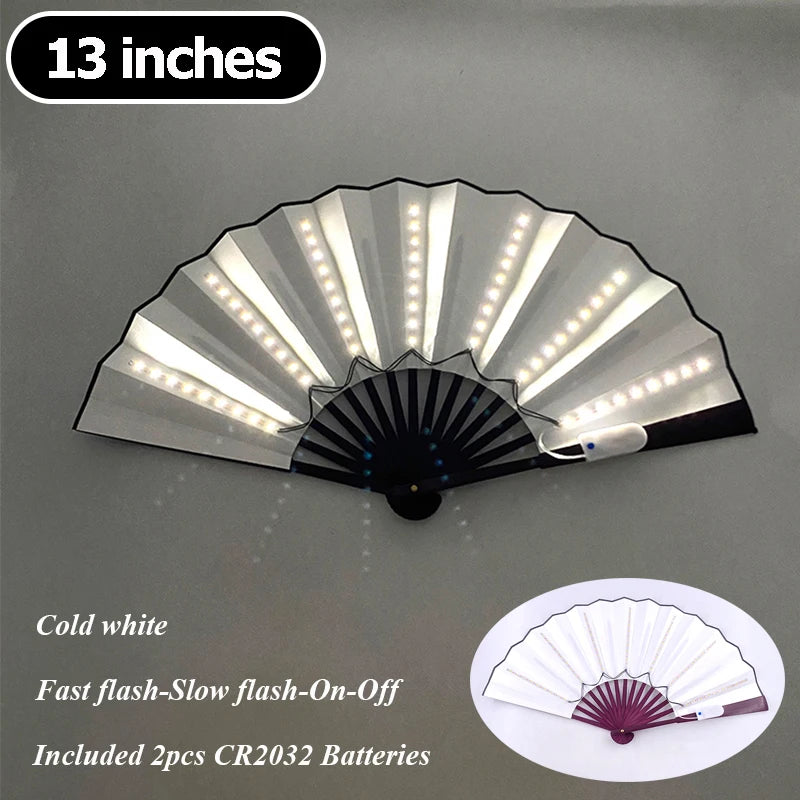 A 13 inch multi-mode LED party fan with a white and black pleated design, featuring fast flash and slow flash modes.