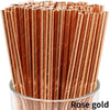 A close-up view of a pack of rose gold biodegradable paper drinking straws.