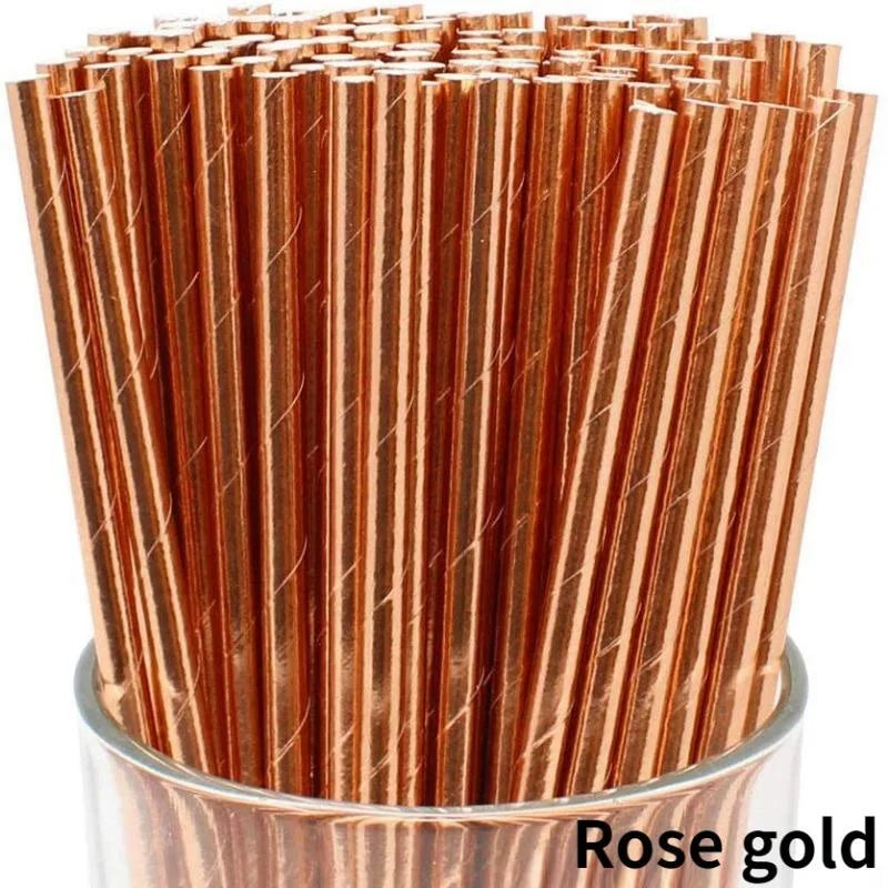 A close-up view of a pack of rose gold biodegradable paper drinking straws.
