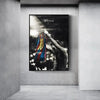 A canvas print featuring a black and white photo of Lionel Messi celebrating a goal.