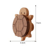 A wooden decorative animal hook shaped like a turtle, used for hanging items.