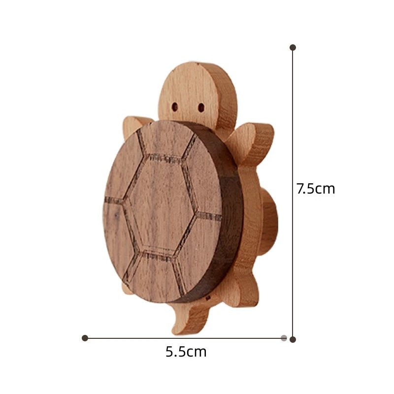 A wooden decorative animal hook shaped like a turtle, used for hanging items.