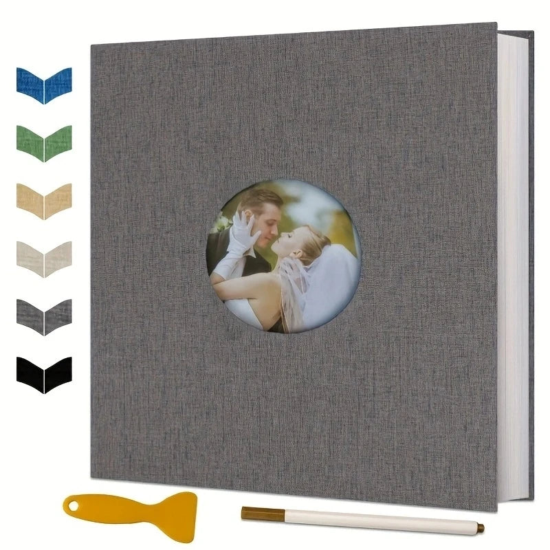 A gray magnetic scrapbook album with a circular photo holder and a yellow tool.