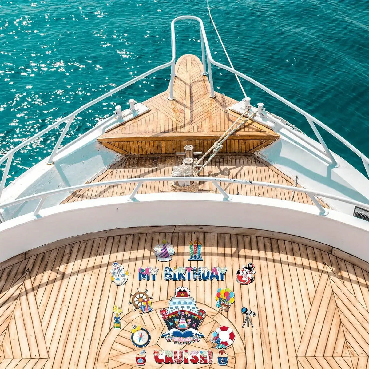 A wooden boat deck with railings and a nautical magnet set featuring captain designs and a cruise theme.