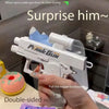A hand holds a white water gun, demonstrating pulling the trigger backwards.
