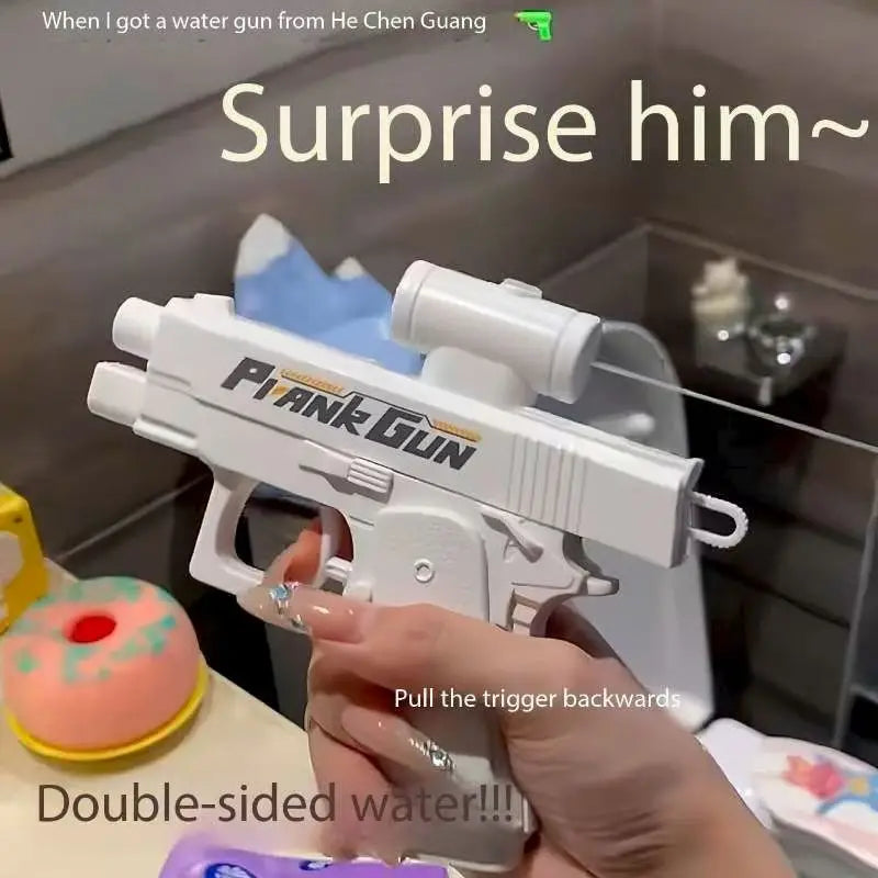 A hand holds a white water gun, demonstrating pulling the trigger backwards.