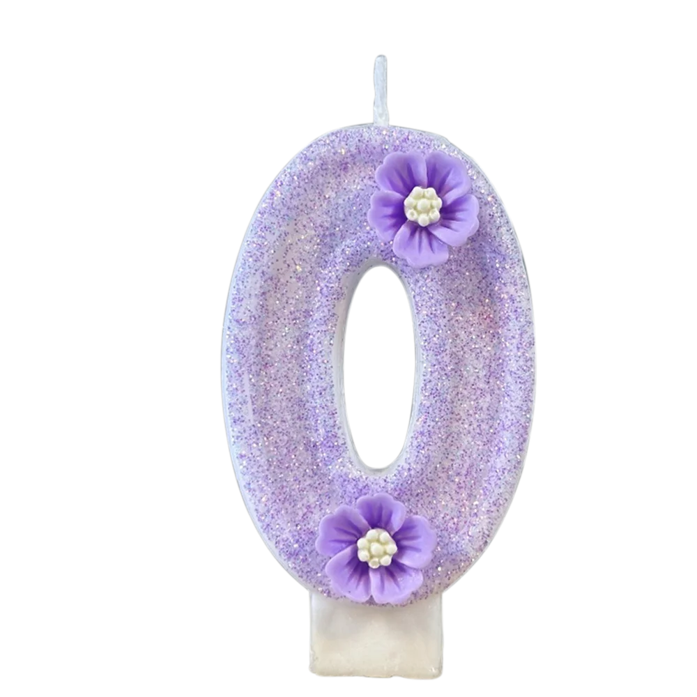 A purple sparkling number zero candle decorated with small purple flowers.