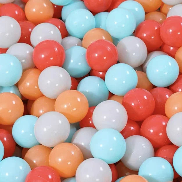 A close-up view of a 50-pack of colorful, glossy plastic balls in shades of orange, pink, white, and light blue.