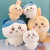 A collection of soft kawaii Chiikawa plush dolls in various colors including pink, blue, and cream.