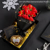 A demonstration picture showing a red rose bouquet inside a black box with glowing wire accents.