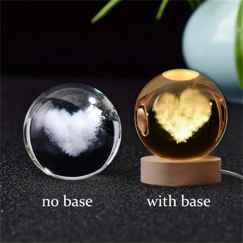 A comparison of a 3D crystal ball night light without a base and with a wooden base.