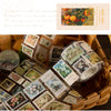 A variety of decorative floral and nature themed washi tape rolls are displayed in a woven basket.