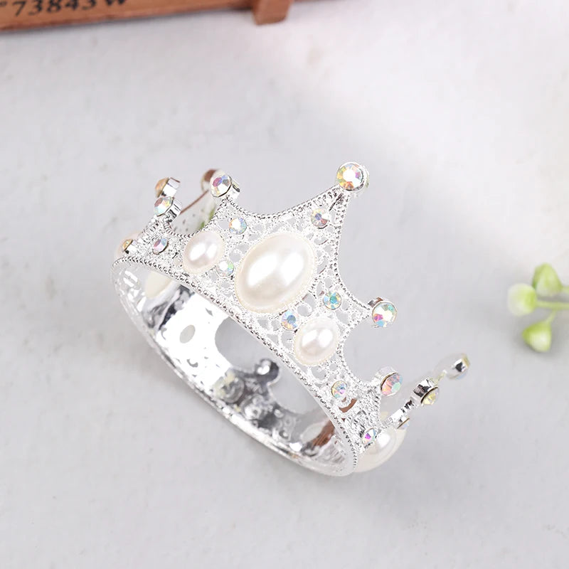Silver tiara crown cake topper and hair accessory decorated with pearls and clear stones