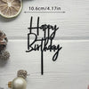 Black acrylic cake topper saying Happy Birthday on a stick with gold accents