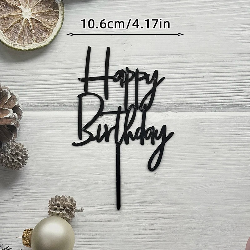 Black acrylic cake topper saying Happy Birthday on a stick with gold accents