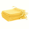 A stack of elegant white and gold drawstring organza bags for gifts, weddings, and parties.