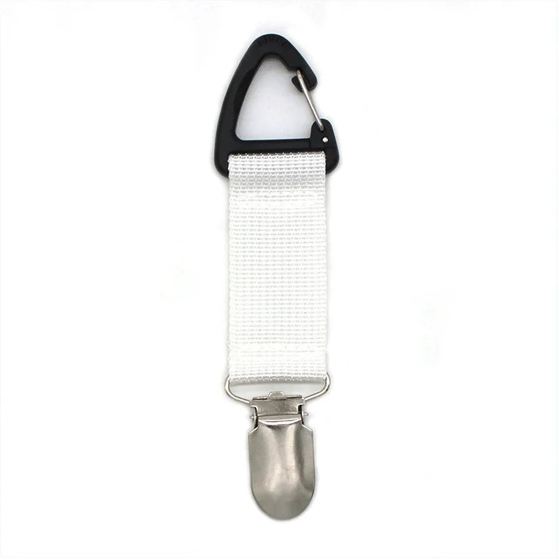 A silver portable straw hat clip with a black loop and white fabric strap.