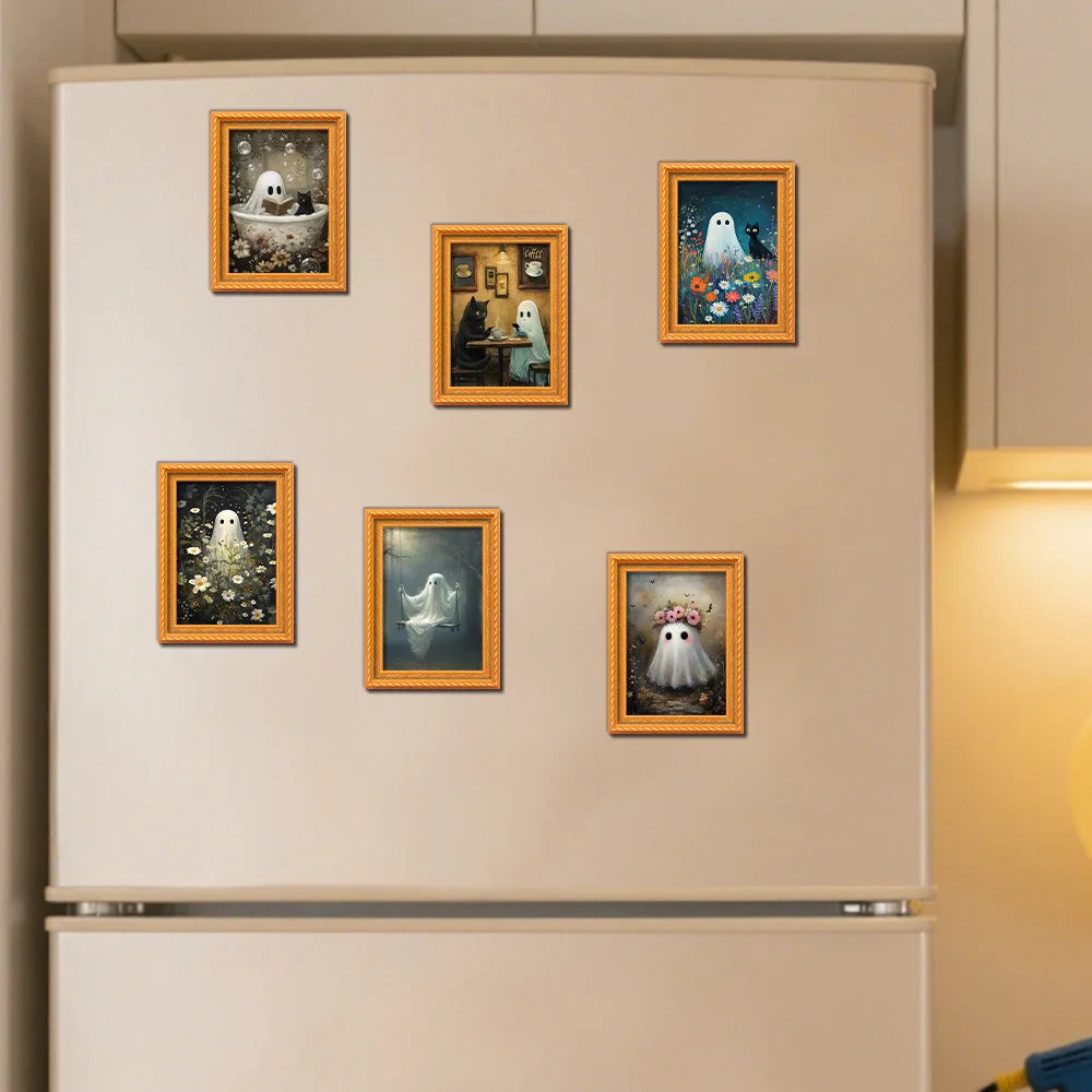 A display of five framed ghost Halloween magnets on a light-colored refrigerator door.