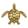 A vintage gold-colored brooch pin set shaped like a sea turtle.