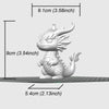 A white miniature dragon desk ornament with a length of 9cm and a height of 9cm.