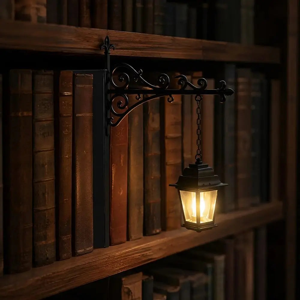A vintage black iron lantern lamp hangs on a wooden bookshelf among old books.